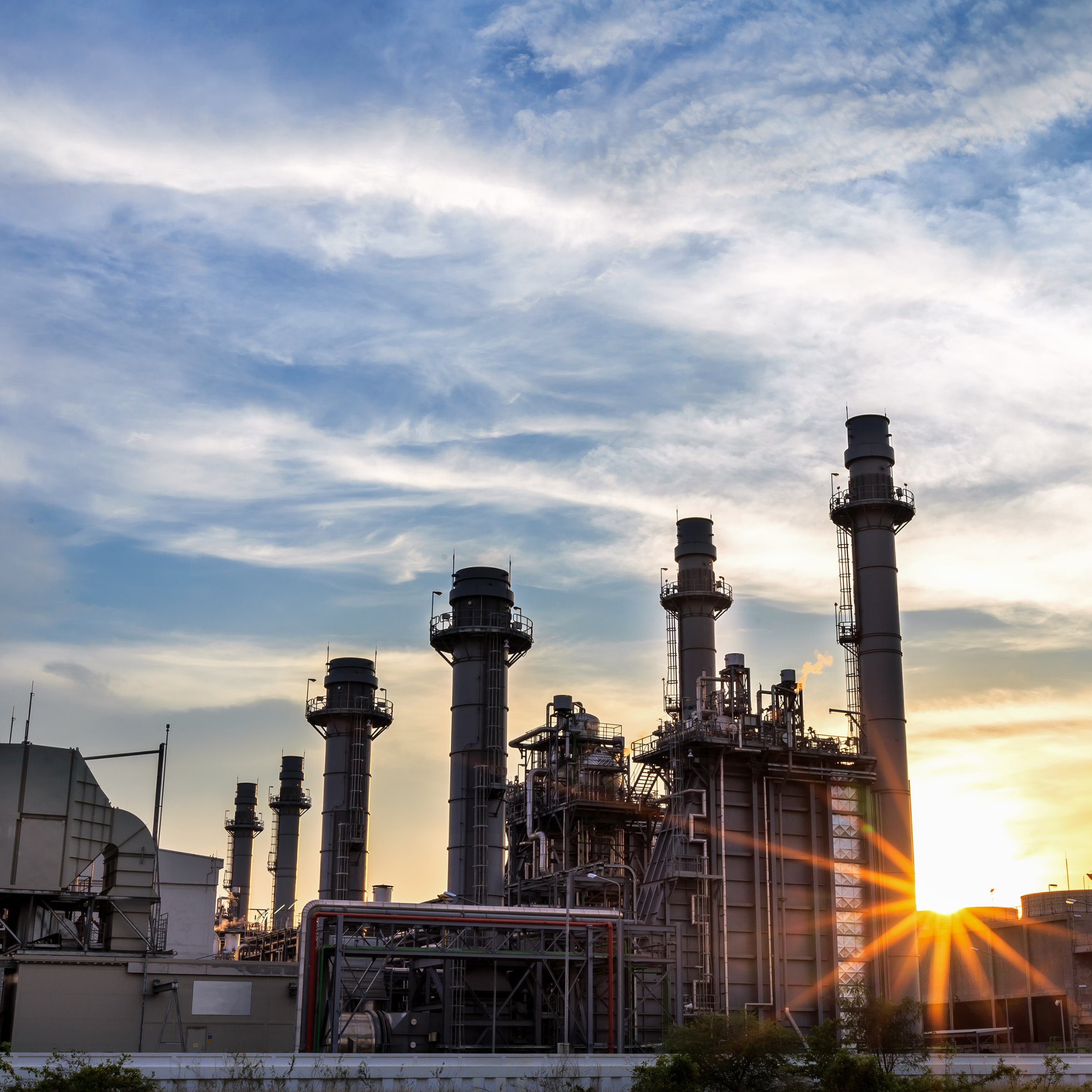 Gas-to-power generation plant at sunset